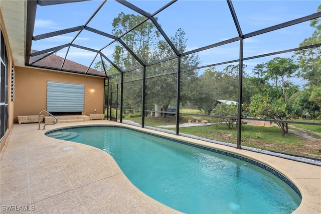 view of pool featuring a patio and glass enclosure