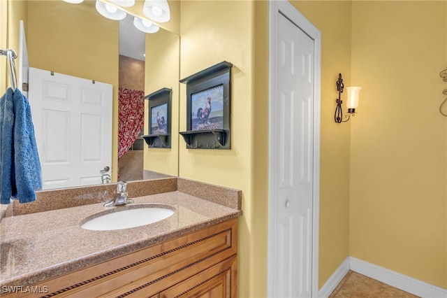 bathroom with tile patterned flooring and vanity