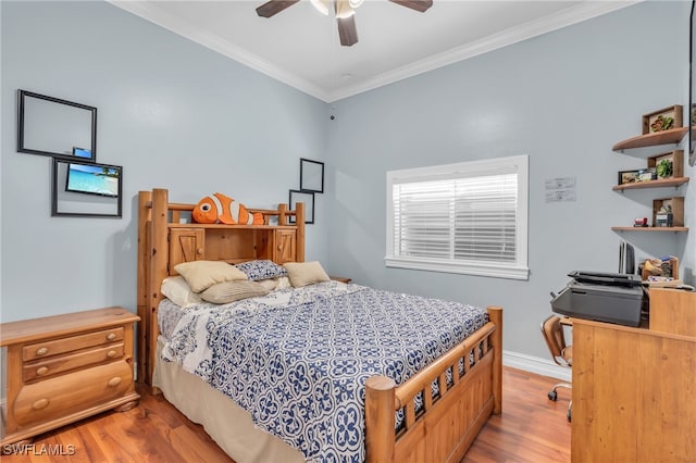 bedroom featuring ceiling fan, light hardwood / wood-style floors, and ornamental molding