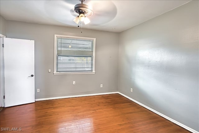 empty room featuring ceiling fan and wood-type flooring