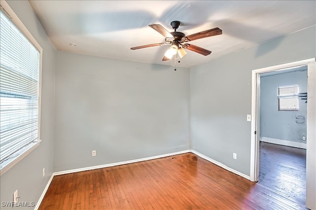 spare room with wood-type flooring and ceiling fan