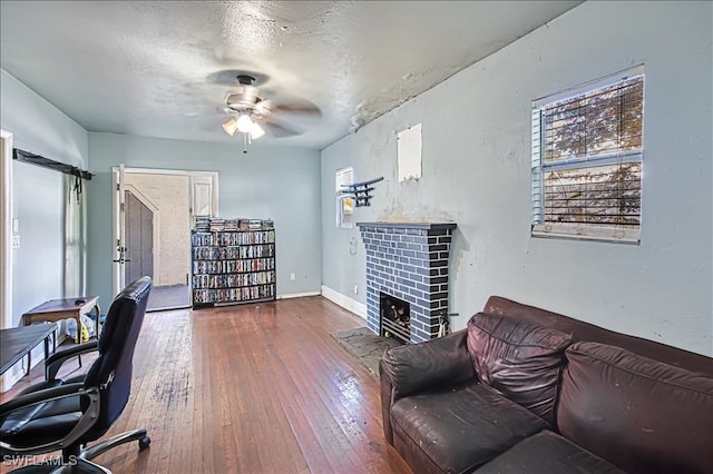 office featuring a textured ceiling, dark hardwood / wood-style floors, and ceiling fan