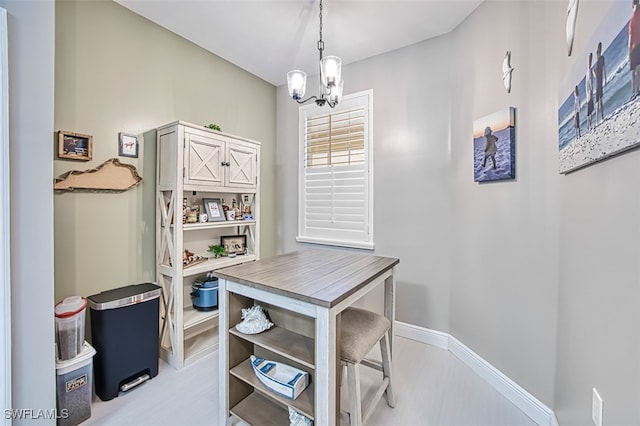 office space with an inviting chandelier