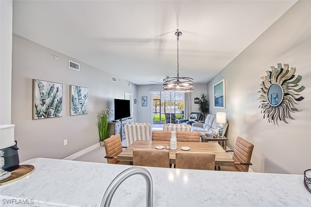 dining room featuring an inviting chandelier