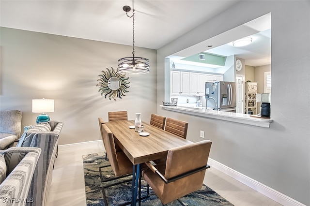 dining room with a notable chandelier