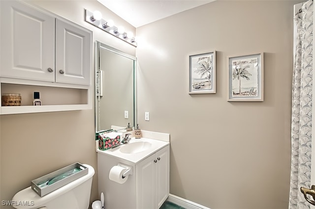 bathroom with vanity and toilet