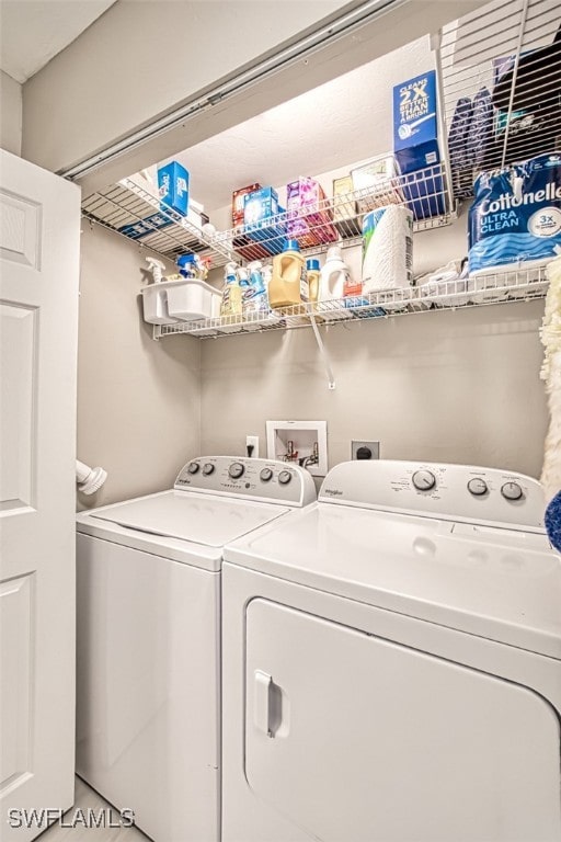 washroom featuring independent washer and dryer