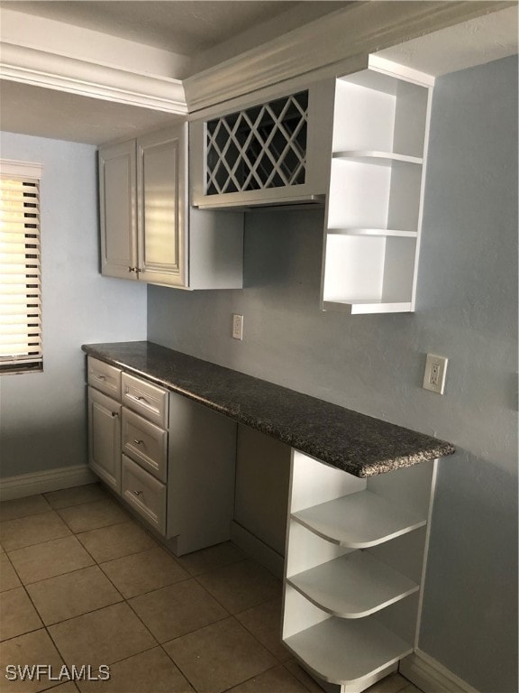 kitchen with tile patterned floors and gray cabinets