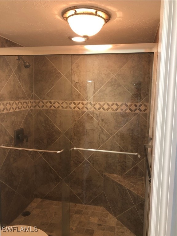 bathroom featuring an enclosed shower