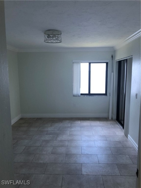 tiled empty room with ornamental molding