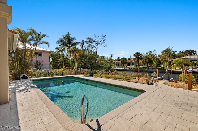 view of swimming pool with a patio