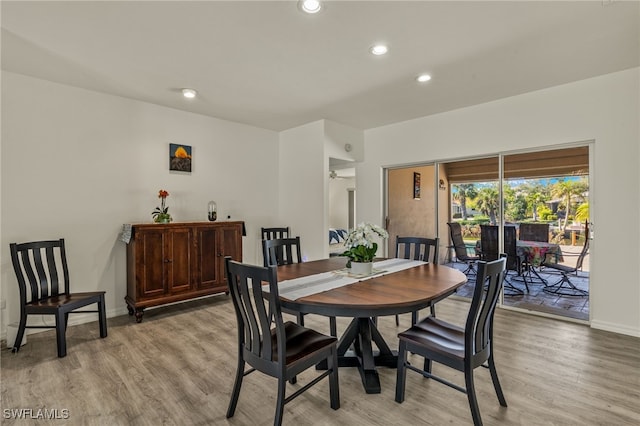 dining space featuring light hardwood / wood-style flooring and ceiling fan