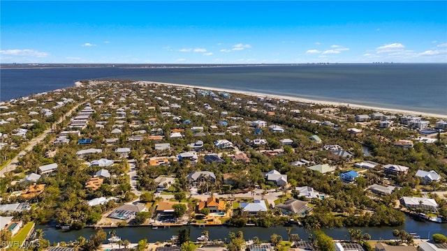 bird's eye view featuring a water view and a view of the beach