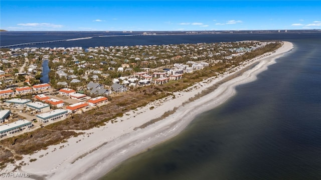 birds eye view of property with a view of the beach and a water view