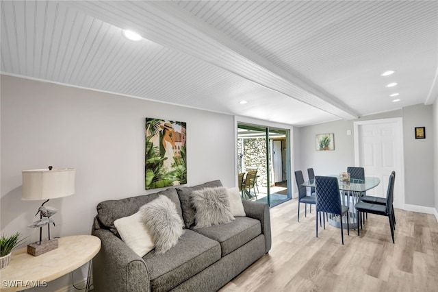 living area with light wood-type flooring, beamed ceiling, baseboards, and recessed lighting