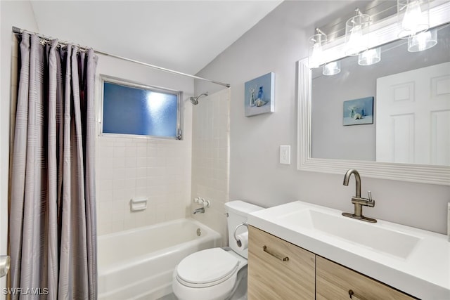 full bathroom with vanity, shower / tub combo, and toilet