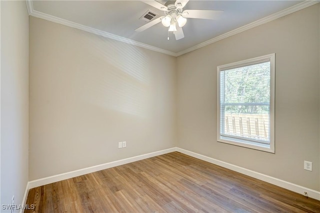 unfurnished room featuring crown molding, hardwood / wood-style floors, and ceiling fan