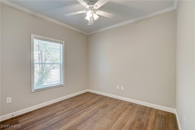 empty room with crown molding, hardwood / wood-style floors, and ceiling fan