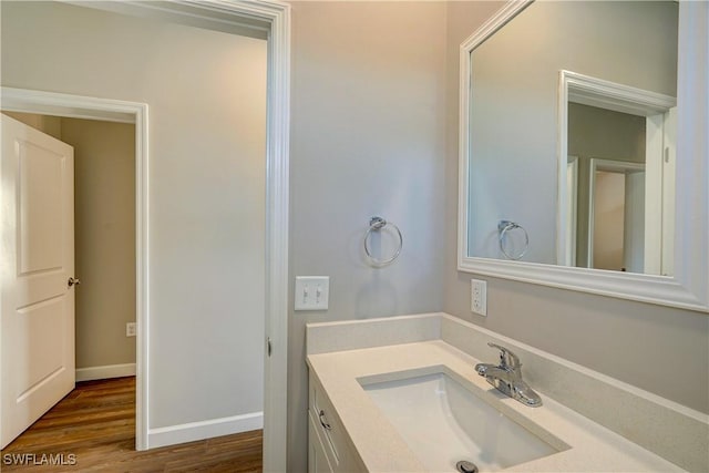 bathroom with vanity and wood-type flooring