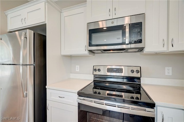 kitchen with white cabinetry and stainless steel appliances