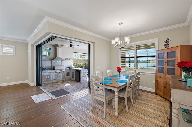 dining space featuring hardwood / wood-style flooring, crown molding, and a wealth of natural light