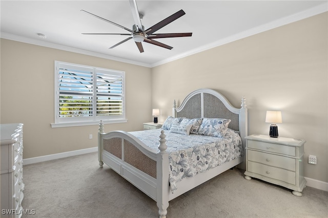 carpeted bedroom with ceiling fan and crown molding