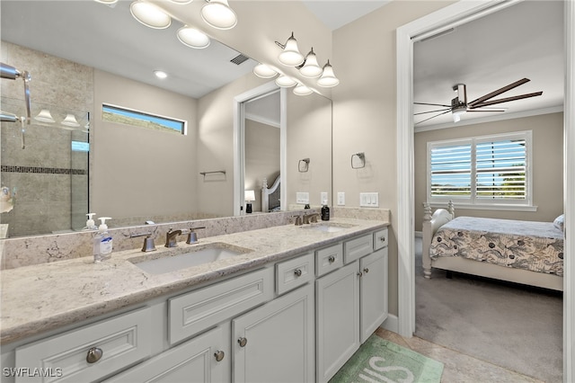 bathroom with ceiling fan, a tile shower, and vanity