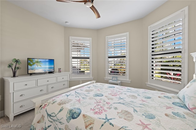 carpeted bedroom featuring ceiling fan