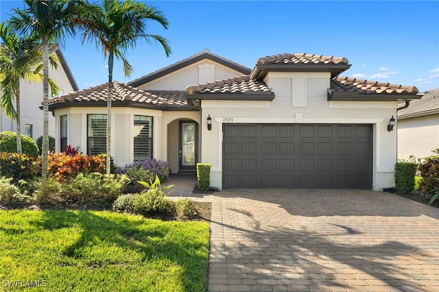 mediterranean / spanish house featuring a garage