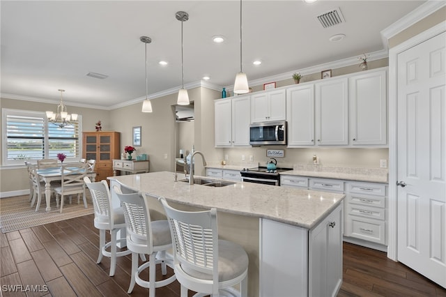 kitchen with white cabinetry, sink, dark wood-type flooring, and appliances with stainless steel finishes