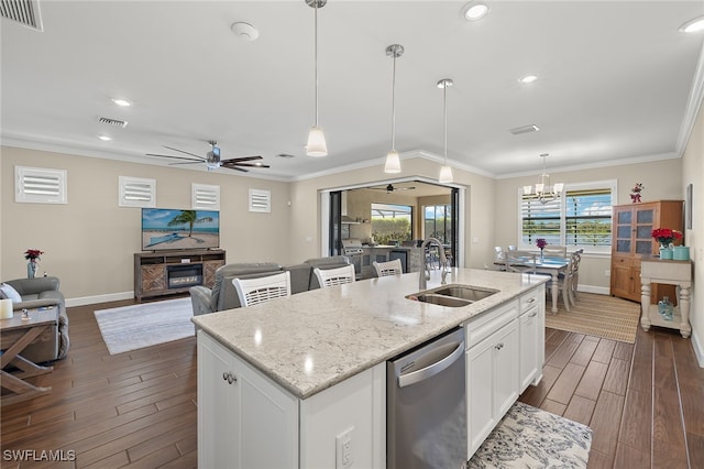 kitchen with dishwasher, dark hardwood / wood-style floors, white cabinetry, and a wealth of natural light