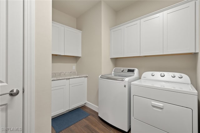 washroom with dark hardwood / wood-style floors, cabinets, and independent washer and dryer