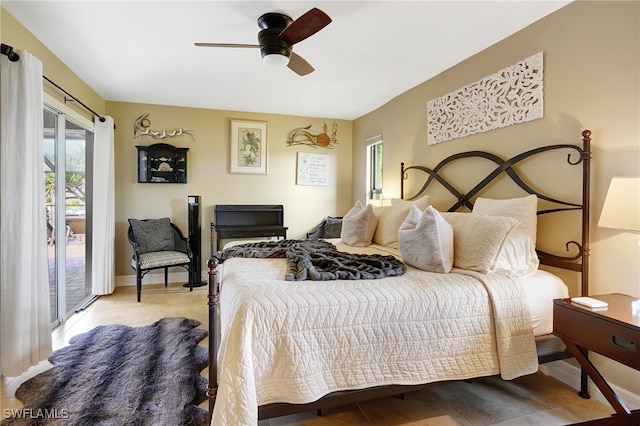 tiled bedroom featuring access to outside and ceiling fan