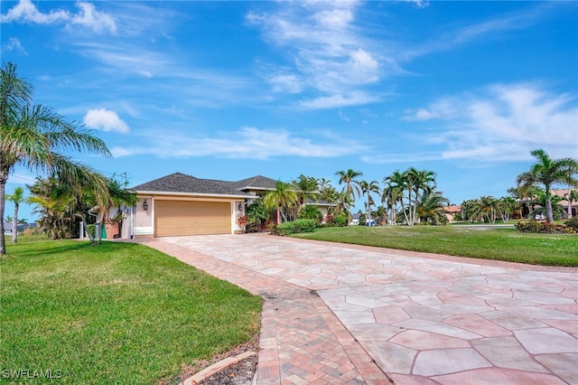 ranch-style home with a front yard and a garage