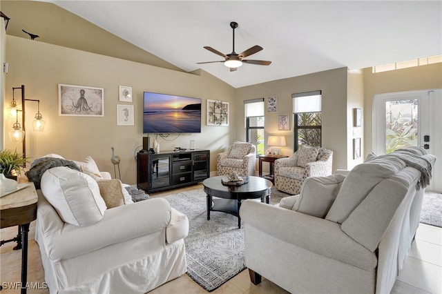 tiled living room featuring vaulted ceiling and ceiling fan