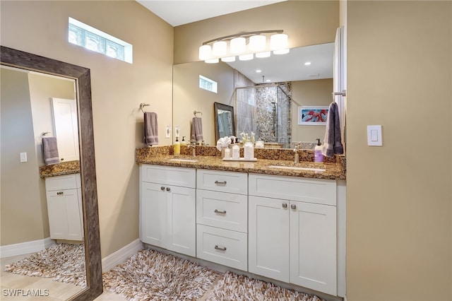 bathroom with vanity and walk in shower