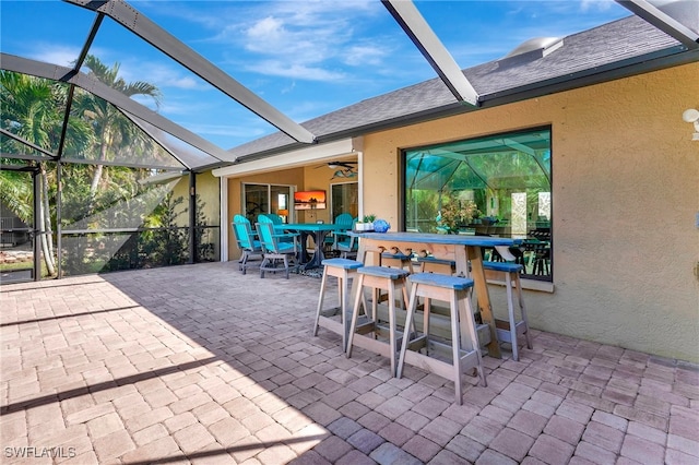 view of patio with glass enclosure