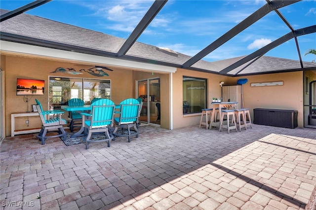 view of patio / terrace featuring a lanai and ceiling fan