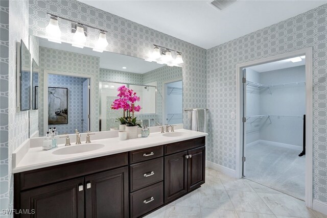 bathroom with vanity and a shower with shower door