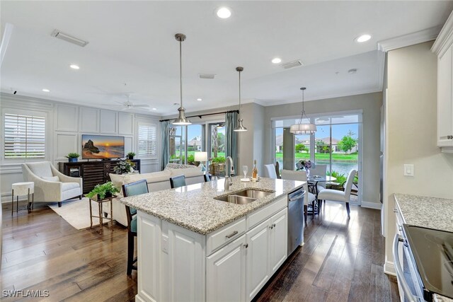 kitchen with white cabinetry, sink, ceiling fan, dark hardwood / wood-style flooring, and appliances with stainless steel finishes