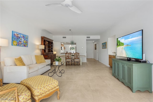 living room featuring ceiling fan