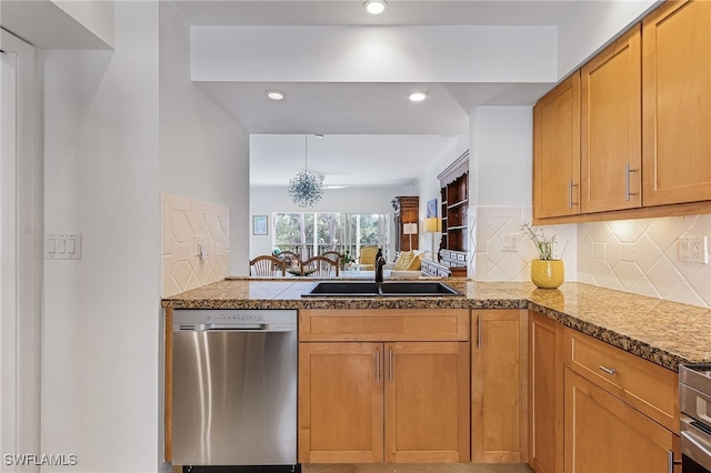 kitchen with dishwasher, decorative backsplash, kitchen peninsula, and sink