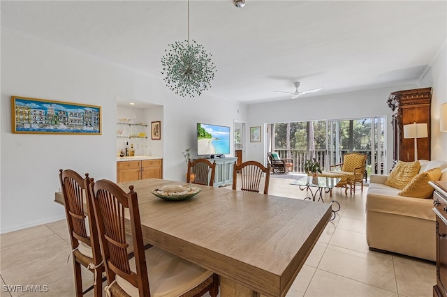 dining space featuring ceiling fan and light tile patterned floors