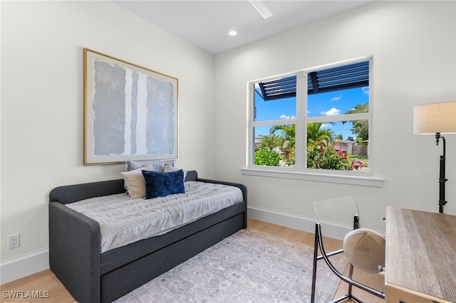 bedroom with light hardwood / wood-style flooring