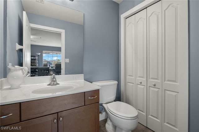 bathroom with vanity and toilet