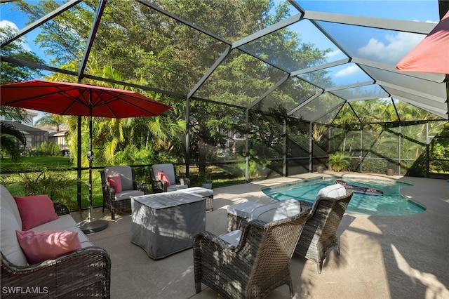 view of pool featuring an outdoor living space, a lanai, and a patio area