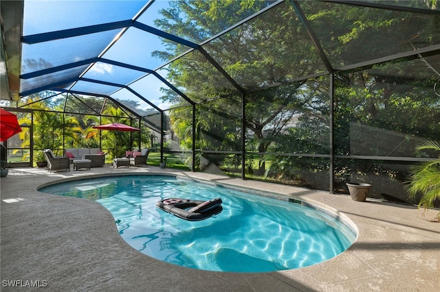 view of pool featuring an outdoor hangout area, a lanai, and a patio area