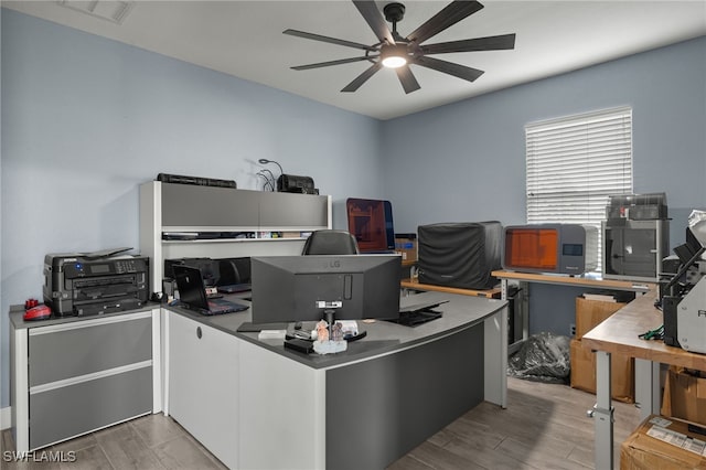 office area with ceiling fan and hardwood / wood-style flooring