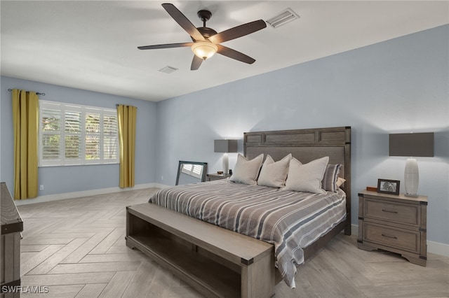 bedroom featuring ceiling fan and light parquet flooring