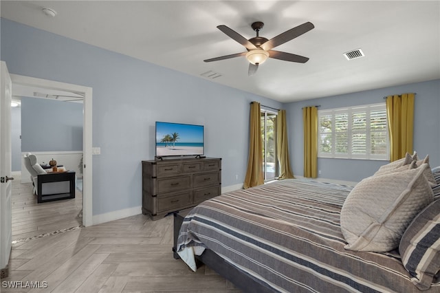 bedroom featuring ceiling fan and light parquet floors